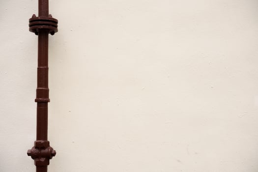 connection of gas pipes on the background of a light wall with copy space photo