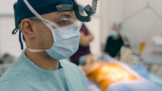 Close up guy man doctor medic physician neurosurgeon anesthetist surgeon in uniform prepare patient for surgical operation in operating room covid-19 health medicine in hospital clinic medical surgery photo