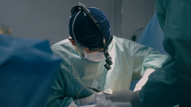 Team surgeons perform operation in operating room professional doctor practitioner using modern medical endoscopic instruments heart surgery remove cancer tumor surgical health procedure in hospital photo