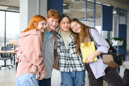 Happy high school students in the classroom photo