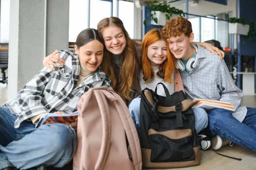 Happy high school students in the classroom photo