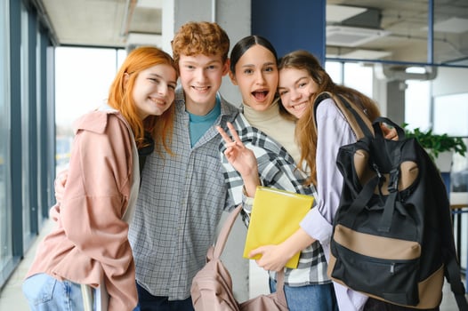 Happy diverse college students posing for group portrait, looking at camera, smiling photo