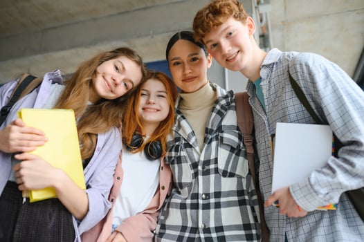 Happy high school students in the classroom photo