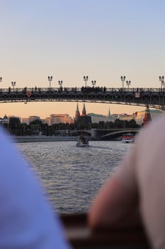 Evening view of The Moscow Kremlin, Boats on Moscow River and Patriarchy bridge, capital of Russia. photo