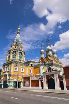 The orange colour orthodox church of St. Gregory of Neocaesarea in Darbitz in Moscow in Russia. photo