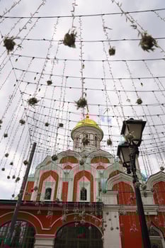 Nikolskaya street lights decoration and Kazan Cathedral on background in city center of Moscow. photo