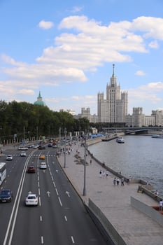 The cityscape of the center of Moscow with Stalin's skyscraper, busy road. photo