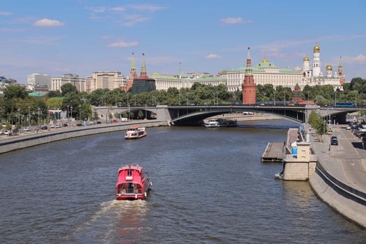 The view of the Moscow Kremlin and Moskva River with cruise ships on it, Russia. photo