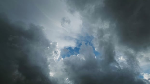 Storm clouds and hole with blue sky photo