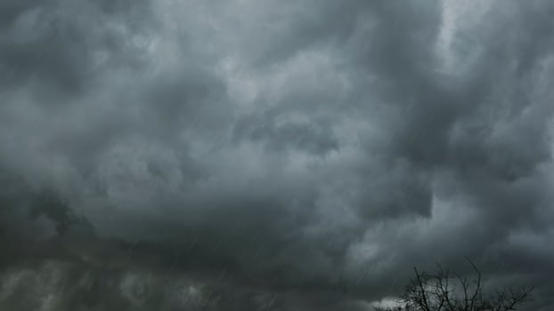 Dark storm clouds and heavy rain photo