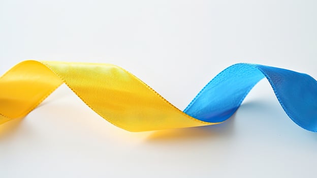A single yellow and blue ribbon elegantly intertwined, symbolizing the colors of the Ukrainian flag photo