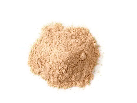 Lucuma powder heap isolated on white background photo