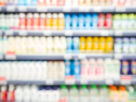 Blurred colorful supermarket products on shelves photo