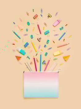 Back to school concept. Pastel beige. Vertical photo