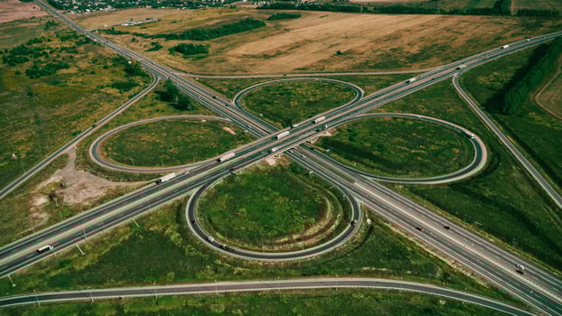 Clover or daisy type of road junction. Aerial view of highway road junction photo