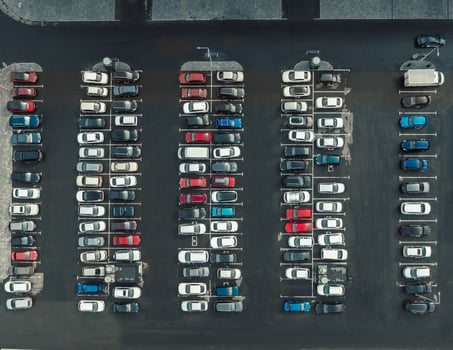 Drone top view of lot of cars parked on car park photo