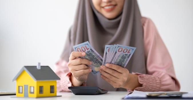Muslim businesswoman dealing with real estate, buying and selling houses and insurance for real estate photo