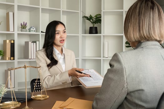 Lawyer and businesswomen discussing and introducing Providing legal advice regarding signing insurance contracts or financial contracts photo