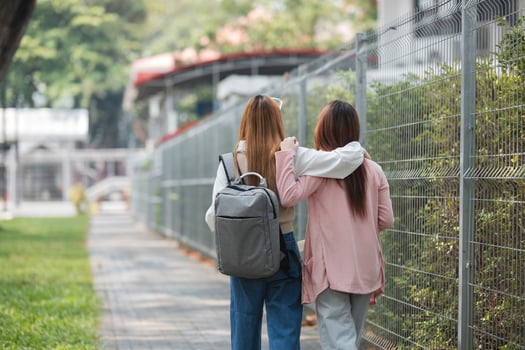 Group of young Asian college students are studying together in university. Students outdoors. Education concept. photo
