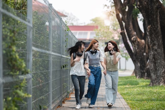 Group of Young Asian student walking and talking at university before class room. education, back to school concept photo