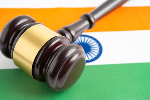 India flag with judge hammer, Law and justice court. photo