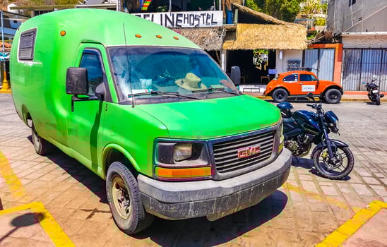 Puerto Escondido Oaxaca Mexico 2023 Green vintage retro classic car vehicle transportation city town Mexico. photo