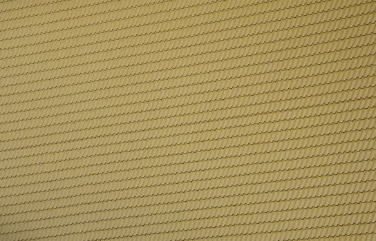 The texture of the roof of painted metal. Close-up detailed view of roof covering for pitched roof. High quality roofing photo