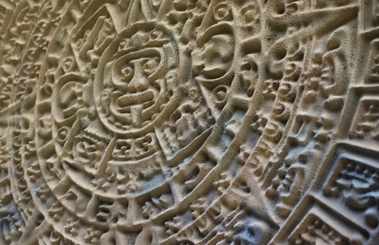 Ancient Mayan Calendar or Aztec calendar with rough relief surface photo
