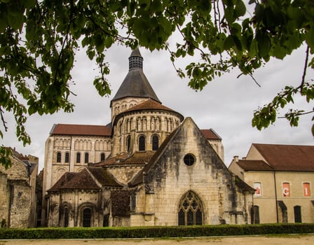 a large church with a tower and a clock tower photo