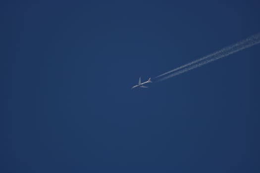 airplane flying in blue sky photo