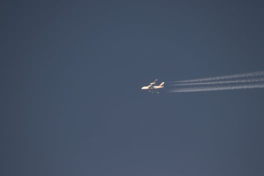 airplane flying in blue sky photo