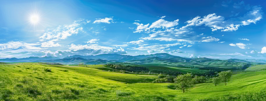 A beautiful landscape with green grass and mountains photo