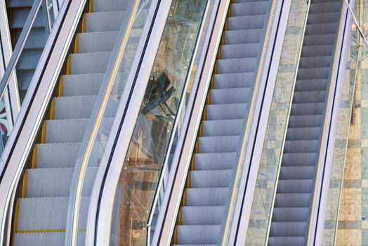 Modern escalators in shopping center photo