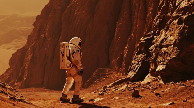 A side view of an astronaut standing on the surface of Mars, surrounded by the towering red cliffs. photo