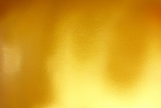 High-Quality Gold Polished Metal Steel Texture Background photo