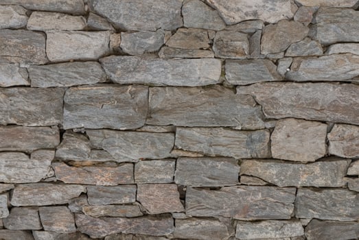Grey Stone Siding, Textured Background of Varied Stone Sizes photo