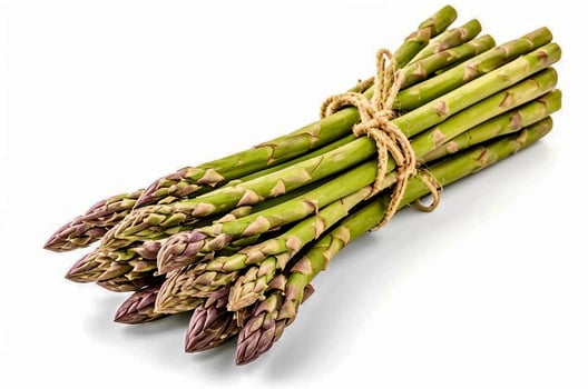 A bunch of asparagus tied up with rope on a white surface photo