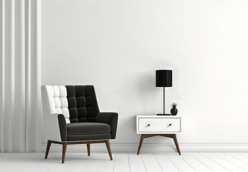 black and white chair and a lamp in a room with a white wall photo