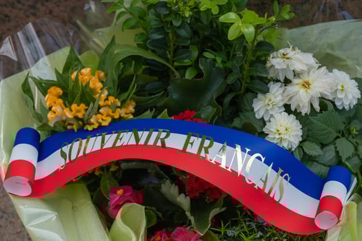 Flowers and ribbon at American cemetery at Normandy area. WWII memorial. photo