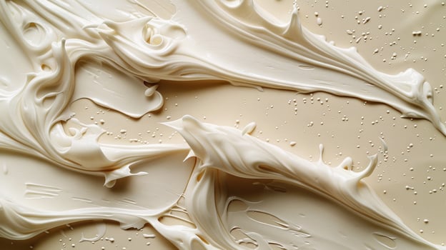 A close up of white frosting on a surface photo