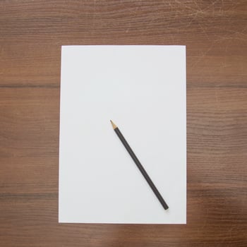 Notebook and pencil on a beautiful background in a large photo studio
