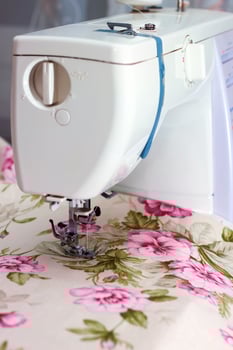 Modern sewing machine and item of clothing photo