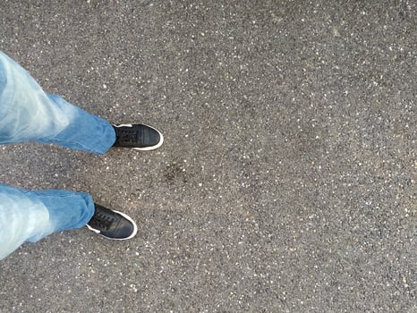 Person Standing in Middle of Street photo