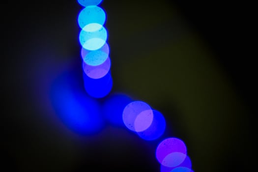 Defocused abstract background of blue light in the night photo