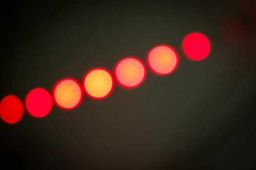 Defocused abstract background of red light in the night photo