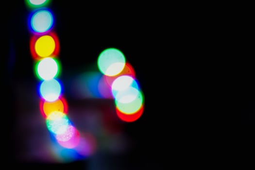 Defocused abstract background of red, blue, and green light in the night photo