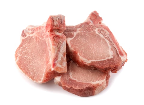 Three pork entrecote isolated on a white background. photo