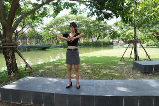 Asian women do freestyle hip hop and breakdancing in a public space in the middle of the city. With a cheerful and happy attitude photo
