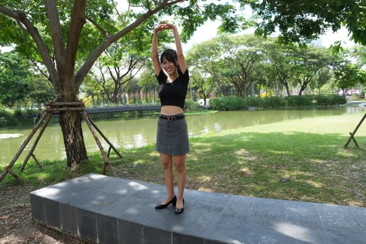 Asian women do freestyle hip hop and breakdancing in a public space in the middle of the city. With a cheerful and happy attitude photo