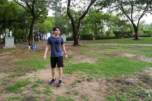 Male soccer players practice using the ball in the park field diligently and happily. photo
